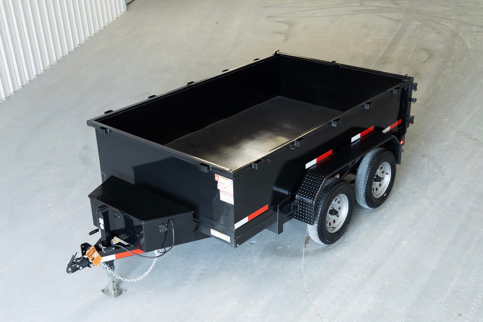 Overhead view of a 5x8 single-axle dump trailer bed, 3,100 lb capacity